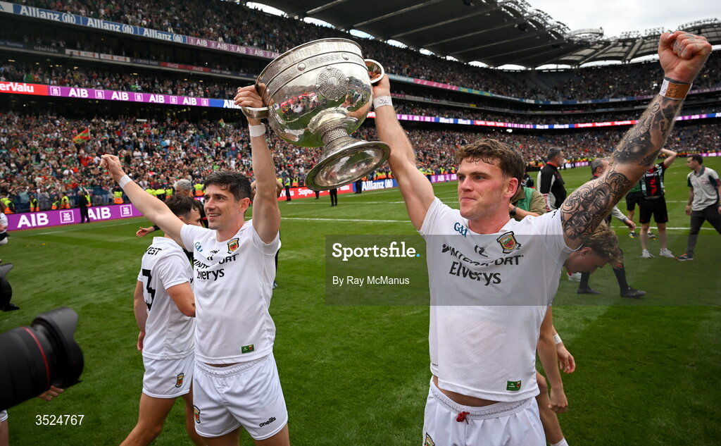 26 July 2026; Conor Loftus and Jordan Flynn of Mayo are surrounded by photographers and TV crews as they hold aloft the Sam Maguire after the GAA Football All-Ireland Senior Championship final match between Kerry and Mayo at Croke Park in Dublin. Photo by Ray McManus/Sportsfile