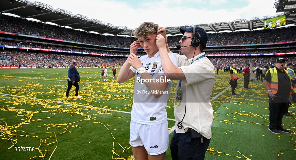 26 July 2026; Kobe McDonald of Mayo has an ear piece added on his way to be interviewed by RTÉ after the GAA Football All-Ireland Senior Championship final match between Kerry and Mayo at Croke Park in Dublin. Photo by Ray McManus/Sportsfile