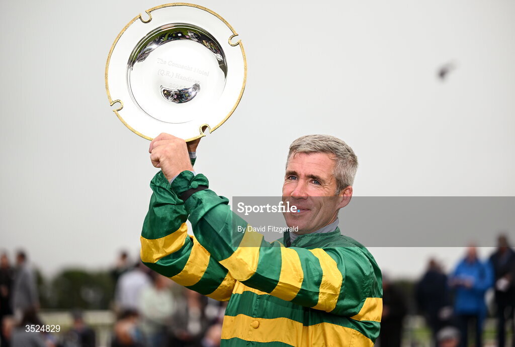 27 July 2026; Jockey Derek O'Connor celebrates with the shield after winning the Connacht Hotel Handicap onboard Comfort Zone during day one of the Galway Races Summer Festival at Ballybrit Racecourse in Galway. Photo by David Fitzgerald/Sportsfile