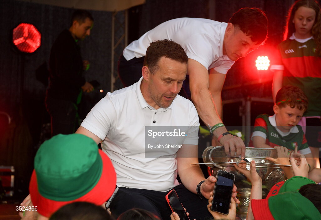 27 July 2026; Mayo manager Andy Moran spends time with young Mayo supporters during the homecoming at Castlebar in Mayo, after being crowned All-Ireland Senior Football champions following their victory over Kerry in the GAA All-Ireland Senior Football Championship final at Croke Park on Sunday. Photo by John Sheridan/Sportsfile