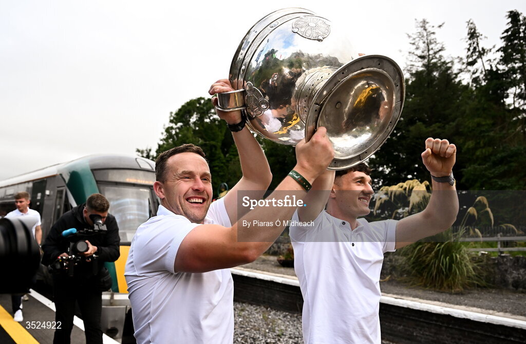 27 July 2026; Mayo manager Andy Moran, left, and Mayo captain Jack Coyne with the Sam Maguire Cup at Castlebar train station during the homecoming celebrations of the All-Ireland Senior Football Champions at Hastings Insurance MacHale Park in Castlebar, Mayo. Photo by Piaras Ó Mídheach/Sportsfile