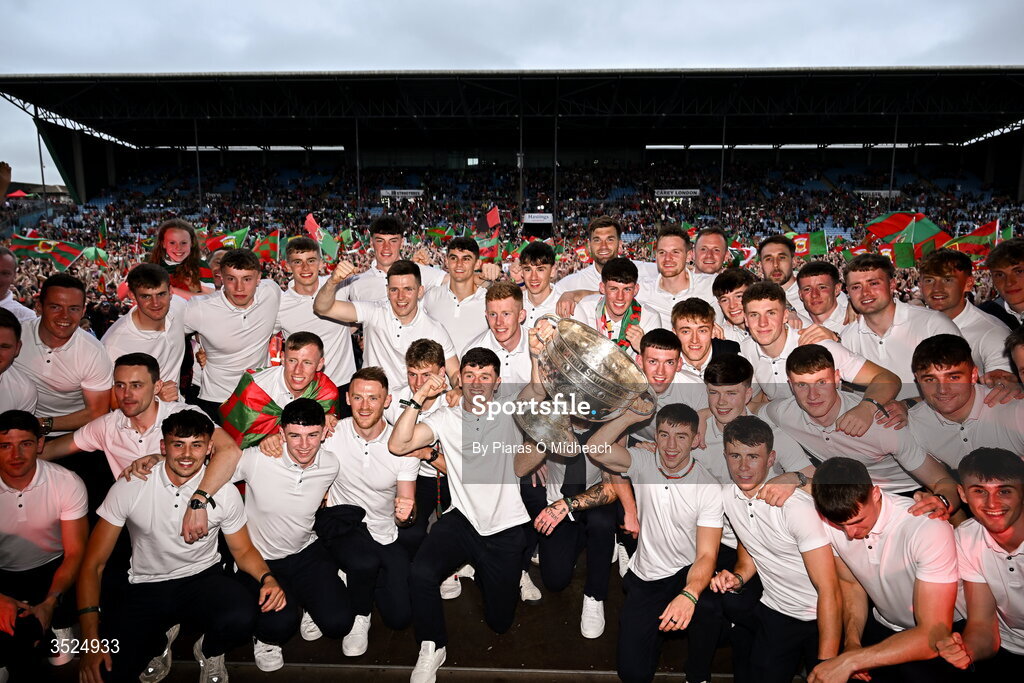 27 July 2026; The Mayo squad pose with the Sam Maguire cup in front of supporters during the homecoming celebrations of the All-Ireland Senior Football Champions at Hastings Insurance MacHale Park in Castlebar, Mayo. Photo by Piaras Ó Mídheach/Sportsfile
