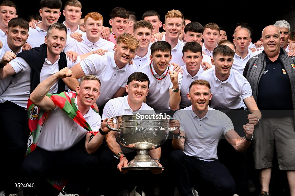27 July 2026; Mayo captain Jack Coyne, bottom centre, celebrates with teammates and backroom staff and the Sam Maguire Cup during the homecoming celebrations of the All-Ireland Senior Football Champions at Hastings Insurance MacHale Park in Castlebar, Mayo. Photo by Piaras Ó Mídheach/Sportsfile