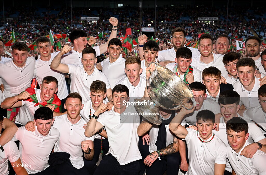 27 July 2026; Mayo captain Jack Coyne, bottom centre, and teammates celebrate with the Sam Maguire Cup during the homecoming celebrations of the All-Ireland Senior Football Champions at Hastings Insurance MacHale Park in Castlebar, Mayo. Photo by Piaras Ó Mídheach/Sportsfile