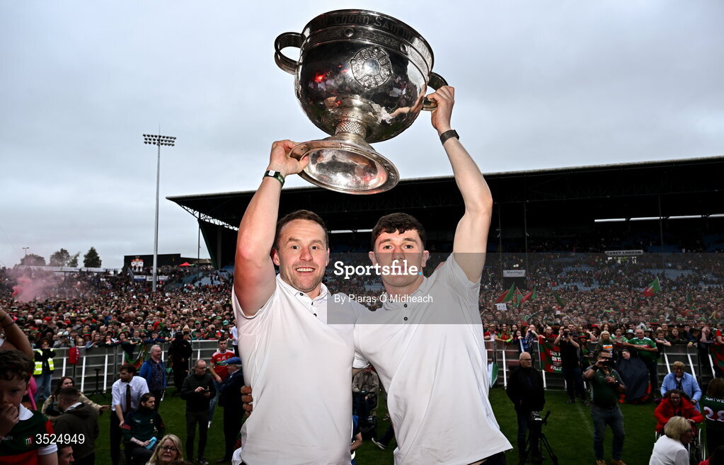 27 July 2026; Mayo manager Andy Moran, left, and Mayo captain Jack Coyne celebrate with the Sam Maguire Cup during the homecoming celebrations of the All-Ireland Senior Football Champions at Hastings Insurance MacHale Park in Castlebar, Mayo. Photo by Piaras Ó Mídheach/Sportsfile
