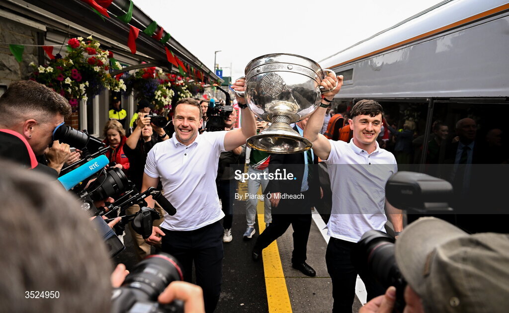 27 July 2026; Mayo manager Andy Moran, left, and Mayo captain Jack Coyne celebrate with the Sam Maguire Cup during the homecoming celebrations of the All-Ireland Senior Football Champions at Hastings Insurance MacHale Park in Castlebar, Mayo. Photo by Piaras Ó Mídheach/Sportsfile