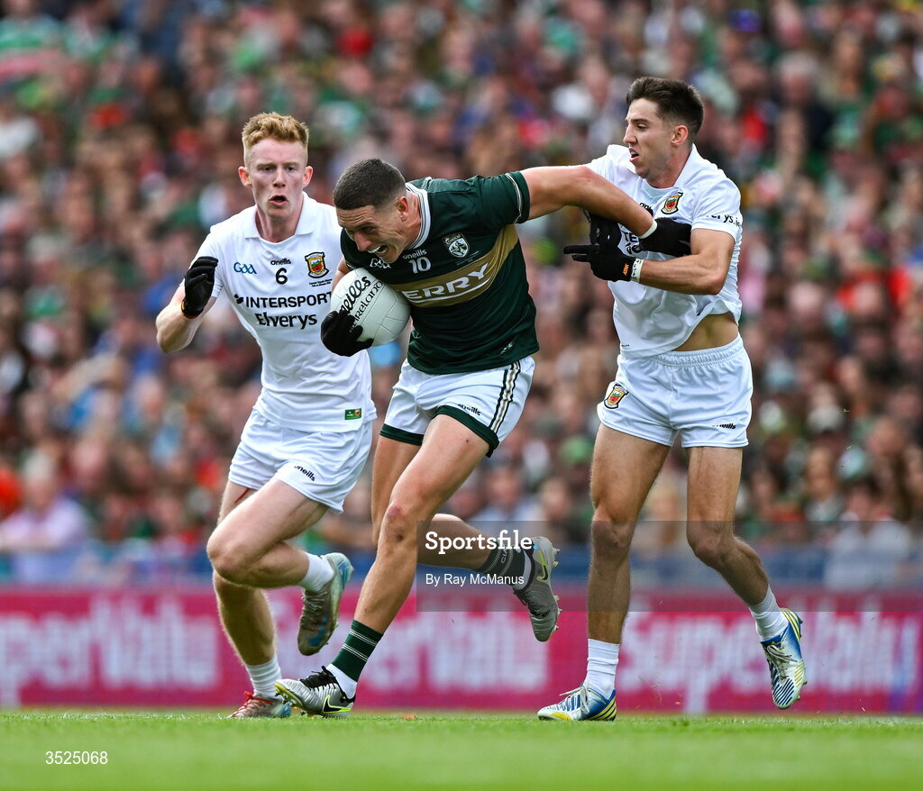 26 July 2026; Joe O'Connor of Kerry is tackled by David McBrien, left, and Enda Hession of Mayo during the GAA Football All-Ireland Senior Championship final match between Kerry and Mayo at Croke Park in Dublin. Photo by Ray McManus/Sportsfile