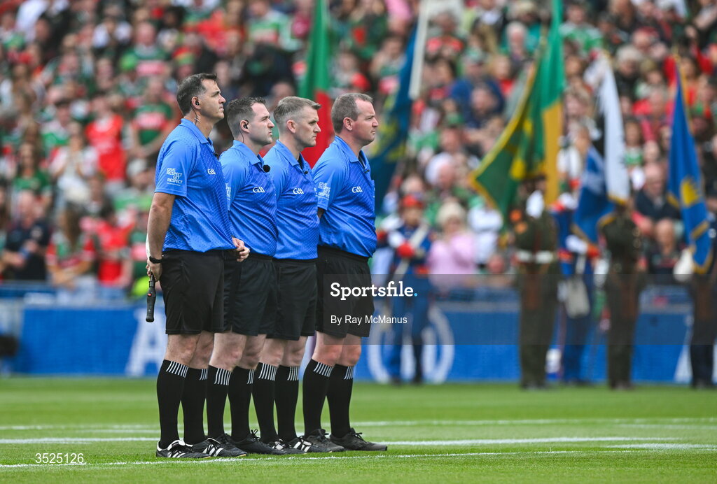 26 July 2026; Match officials, from left, standby referee Sean Hurson, match referee Martin McNally, line umpire Thomas Murphy and sideline official Sean Lonergan, all stand for the playing of Amhrán na bhFiann before the GAA Football All-Ireland Senior Championship final match between Kerry and Mayo at Croke Park in Dublin. Photo by Ray McManus/Sportsfile