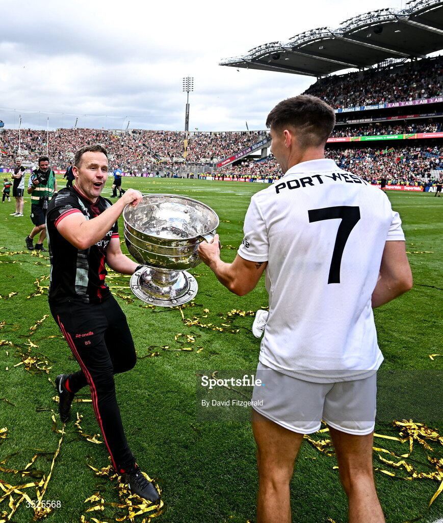 26 July 2026; Mayo manager Andy Moran, left, and Enda Hession of Mayo celebrate with the Sam Maguire Cup after their side's victory in the GAA Football All-Ireland Senior Championship final match between Kerry and Mayo at Croke Park in Dublin. Photo by David Fitzgerald/Sportsfile