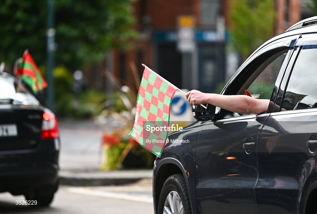 26 July 2026; A passenger in a car waves a Mayo flag near Croke Park before the GAA Football All-Ireland Senior Championship final match between Kerry and Mayo at Croke Park in Dublin. Photo by Piaras Ó Mídheach/Sportsfile