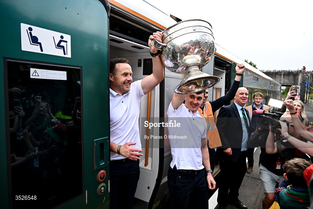 27 July 2026; Mayo manager Andy Moran, left, and Mayo captain Jack Coyne with the Sam Maguire Cup at Castlebar train station before the homecoming celebrations of the All-Ireland Senior Football Champions at Hastings Insurance MacHale Park in Castlebar, Mayo. Photo by Piaras Ó Mídheach/Sportsfile