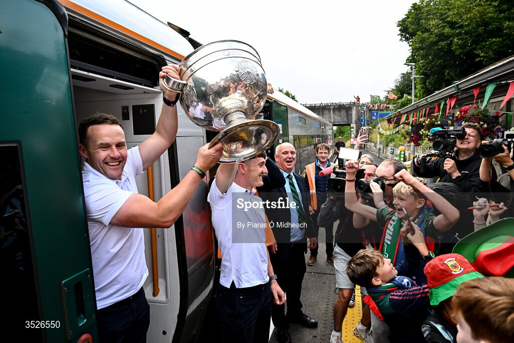 27 July 2026; Mayo manager Andy Moran, left, and Mayo captain Jack Coyne with the Sam Maguire Cup at Castlebar train station before the homecoming celebrations of the All-Ireland Senior Football Champions at Hastings Insurance MacHale Park in Castlebar, Mayo. Photo by Piaras Ó Mídheach/Sportsfile