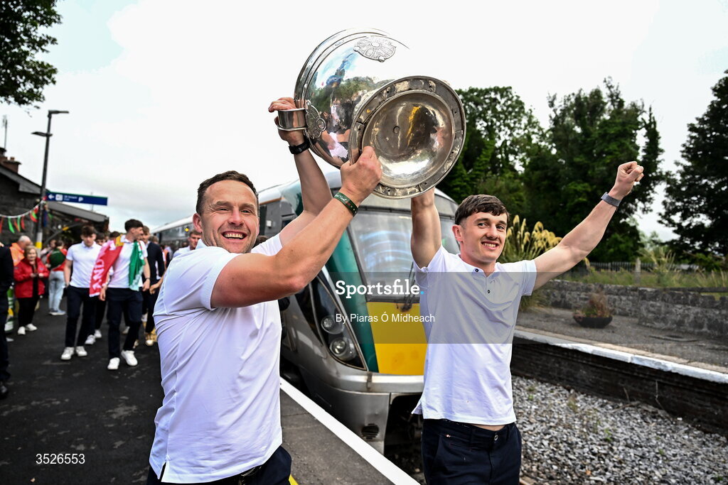 27 July 2026; Mayo manager Andy Moran, left, and Mayo captain Jack Coyne with the Sam Maguire Cup at Castlebar train station before the homecoming celebrations of the All-Ireland Senior Football Champions at Hastings Insurance MacHale Park in Castlebar, Mayo. Photo by Piaras Ó Mídheach/Sportsfile