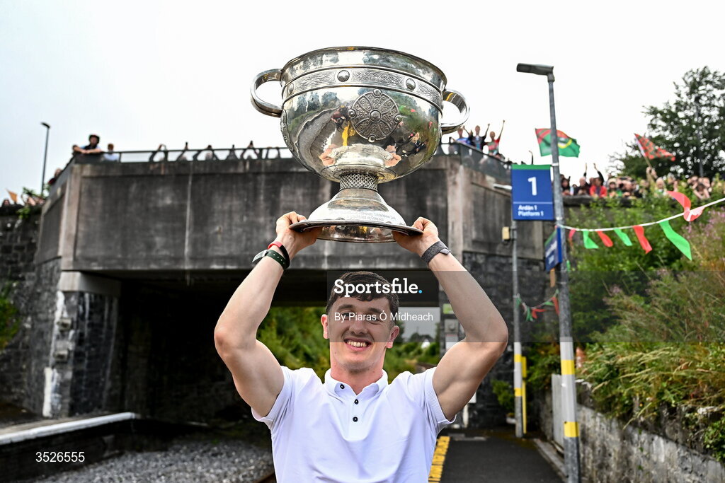 27 July 2026; Mayo captain Jack Coyne celebrates with the Sam Maguire Cup at Castlebar train station before the homecoming celebrations of the All-Ireland Senior Football Champions at Hastings Insurance MacHale Park in Castlebar, Mayo. Photo by Piaras Ó Mídheach/Sportsfile