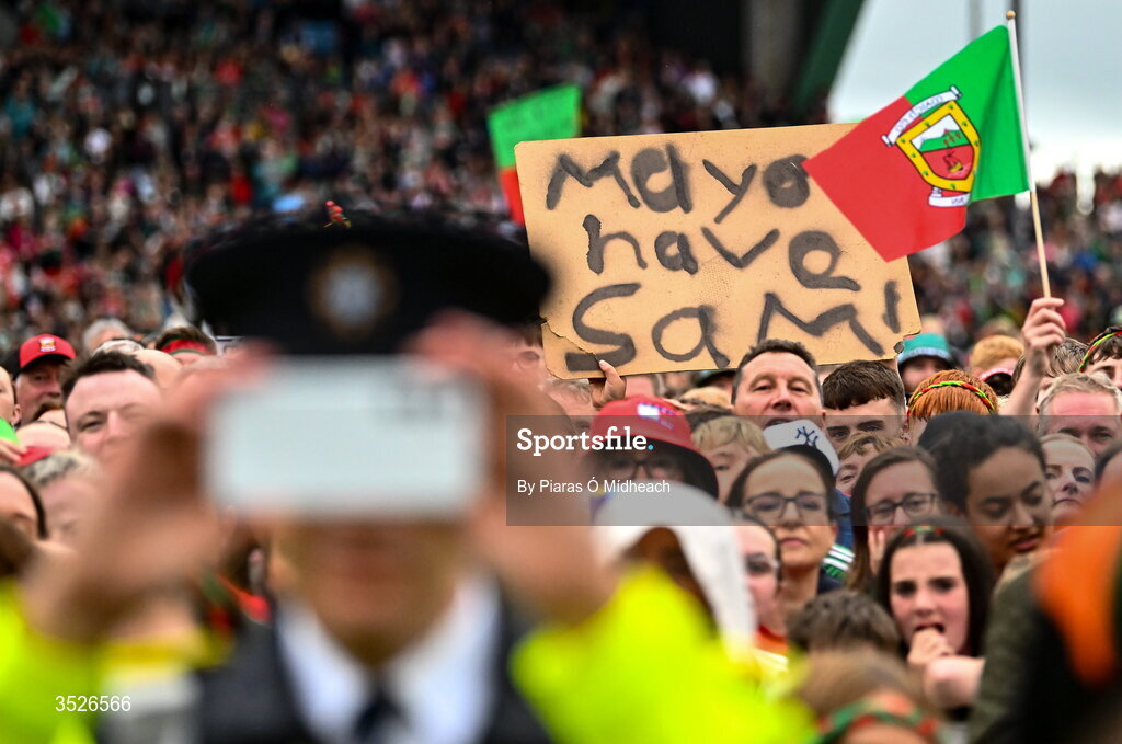 27 July 2026; A general view of some of the crowd as a member of an Garda Síochána records a video of players on stage during the homecoming celebrations of the All-Ireland Senior Football Champions at Hastings Insurance MacHale Park in Castlebar, Mayo. Photo by Piaras Ó Mídheach/Sportsfile