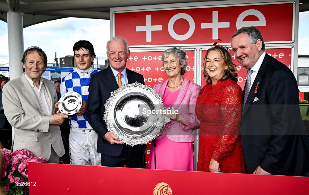 29 July 2026; Trainer Willie Mullins is presented with the trophy by Uachtarán na hÉireann Catherine Connolly, after sending out King Alexander and jockey Daniel King to win the Tote Galway Plate during day three of the Galway Races Summer Festival at Ballybrit Racecourse in Galway. Photo by Seb Daly/Sportsfile