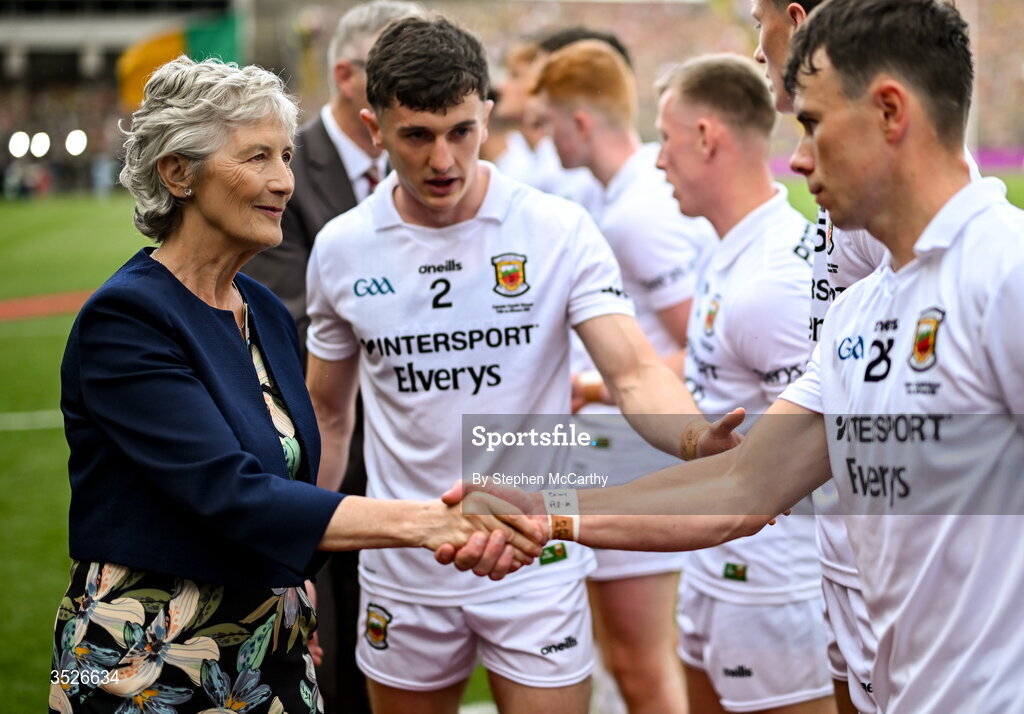 26 July 2026; President of Ireland Catherine Connolly is introduced to Mayo's Tommy Conroy, right, by team captain Jack Coyne during the GAA Football All-Ireland Senior Championship final match between Kerry and Mayo at Croke Park in Dublin. Photo by Stephen McCarthy/Sportsfile