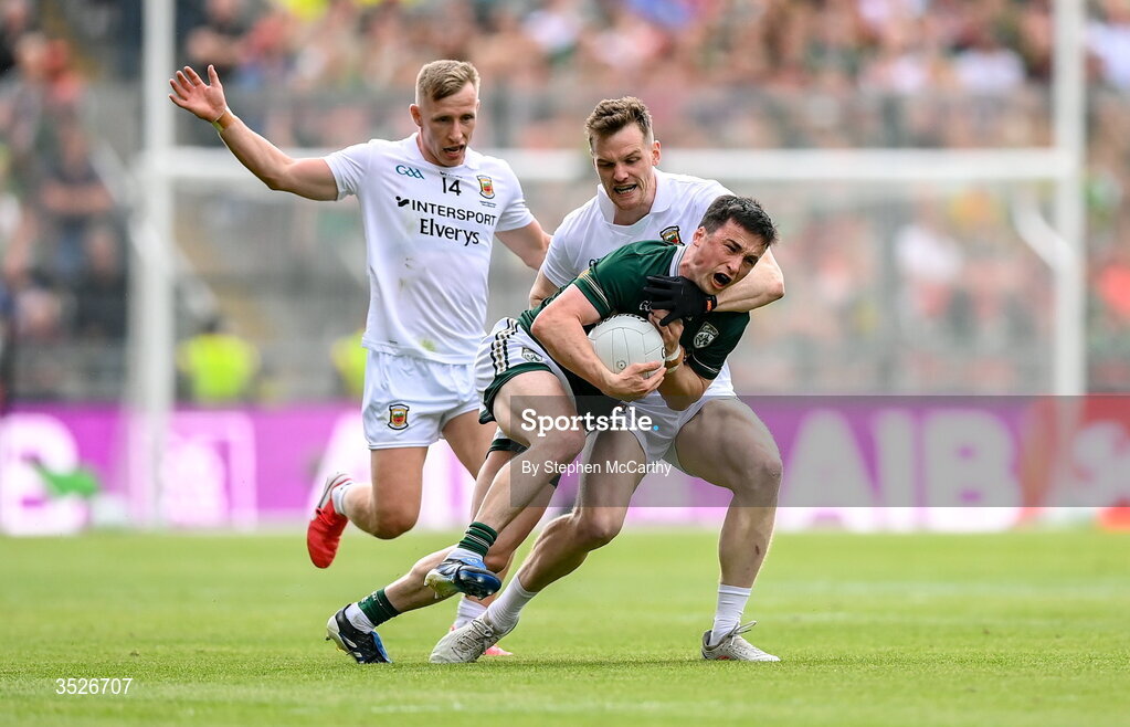 26 July 2026; Paul Murphy of Kerry is tackled by Matthew Ruane and Ryan O'Donoghue, left, of Mayo during the GAA Football All-Ireland Senior Championship final match between Kerry and Mayo at Croke Park in Dublin. Photo by Stephen McCarthy/Sportsfile