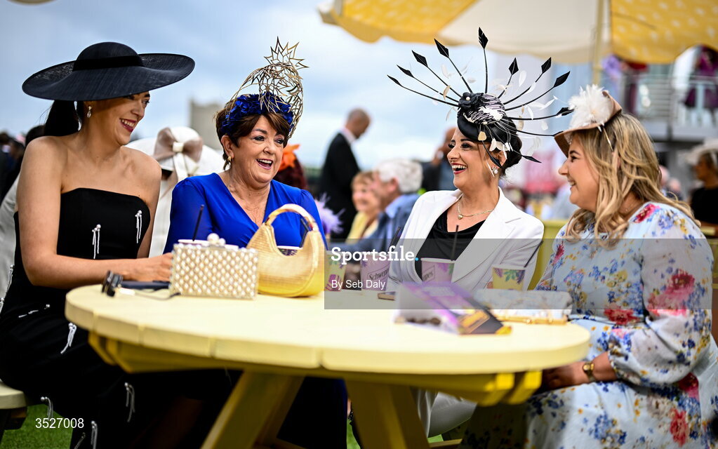 30 July 2026; Racegoers, from left, Siobhan McDonagh, and Una McDonagh, from Kiltullagh, Galway, Carrina Laheen, from Menlough, Galway, and Mary Jarrett, from Dunboyne, Meath, during day four of the Galway Races Summer Festival at Ballybrit Racecourse in Galway. Photo by Seb Daly/Sportsfile