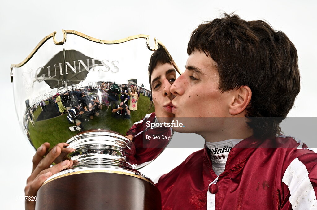 30 July 2026; Jockey Daniel King kisses the trophy after winning the Guinness Galway Hurdle Handicap on Putapoundinthejar during day four of the Galway Races Summer Festival at Ballybrit Racecourse in Galway. Photo by Seb Daly/Sportsfile
