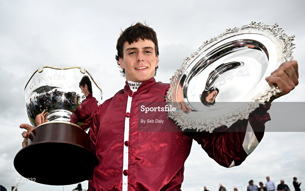 30 July 2026; Jockey Daniel King with the Guinness Galway Hurdle Handicap trophy and Galway Plate trophy after winning the Guinness Galway Hurdle Handicap on Putapoundinthejar during day four of the Galway Races Summer Festival at Ballybrit Racecourse in Galway. Photo by Seb Daly/Sportsfile