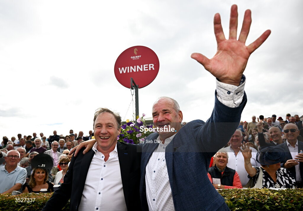 30 July 2026; Trainer Tony Martin, right, and owner Ray Grehan celebrate after sending out Putapoundinthejar to win the Guinness Galway Hurdle Handicap during day four of the Galway Races Summer Festival at Ballybrit Racecourse in Galway. Photo by Seb Daly/Sportsfile