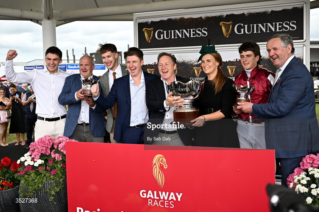 30 July 2026; Winning connections, including jockey Daniel King, owner Ray Grehan, and trainer Tony Martin, after sending out Putapoundinthejar to win the Guinness Galway Hurdle Handicap during day four of the Galway Races Summer Festival at Ballybrit Racecourse in Galway. Photo by Seb Daly/Sportsfile