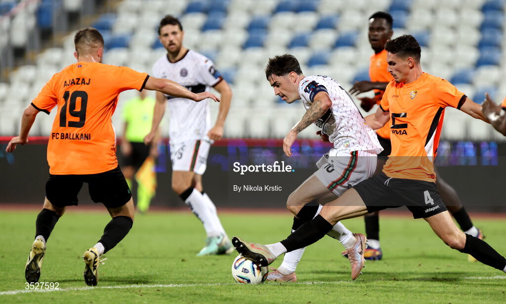 30 July 2026; Dawson Devoy of Bohemians in action against Gentrit Halili, right, and Ajazaj Engjell of Ballkani during the UEFA Conference League Second Qualifying Round second leg match between Ballkani and Bohemians at Fadil Vokrri Stadium in Pristina, Kosovo. Photo by Nikola Krstic/Sportsfile