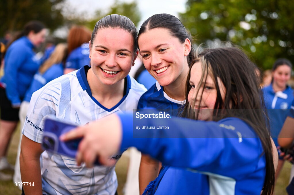 30 July 2026; Sarah Delaney, left, and Jade Gaffney with supporters after an Leinster rugby women open training session at Kings Hospital School in Dublin. Photo by Shauna Clinton/Sportsfile