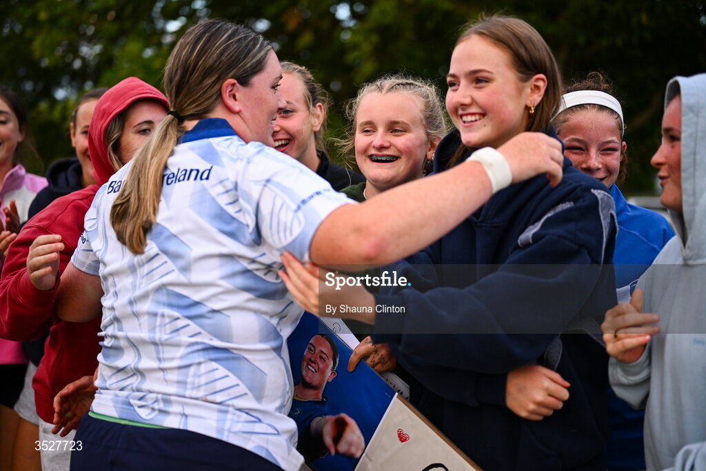 30 July 2026; Hannah Wilson with supporters after an Leinster rugby women open training session at Kings Hospital School in Dublin. Photo by Shauna Clinton/Sportsfile