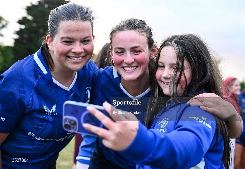 30 July 2026; Méabh Keegan, left, and Regan Casey with supporters after an Leinster rugby women open training session at Kings Hospital School in Dublin. Photo by Shauna Clinton/Sportsfile