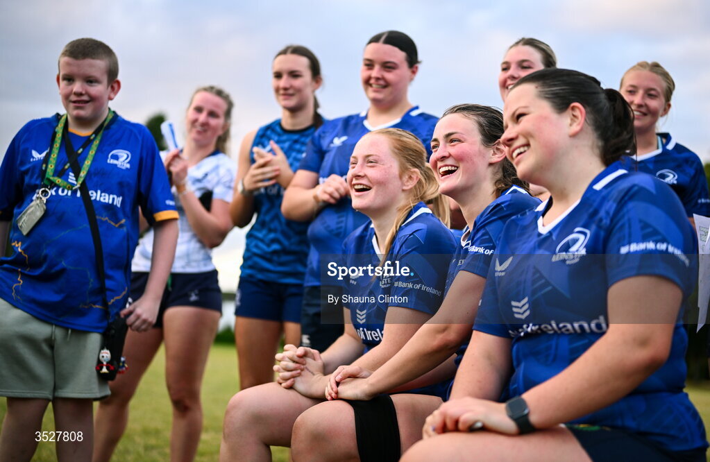 30 July 2026; Regan Casey, centte, and team-mates with supporters after an Leinster rugby women open training session at Kings Hospital School in Dublin. Photo by Shauna Clinton/Sportsfile