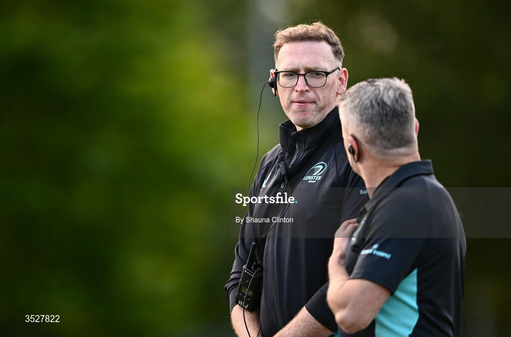30 July 2026; Physio Stephen Armstrong, left, speaks with attack and defence coach Paul Rossiter during an Leinster rugby women open training session at Kings Hospital School in Dublin. Photo by Shauna Clinton/Sportsfile
