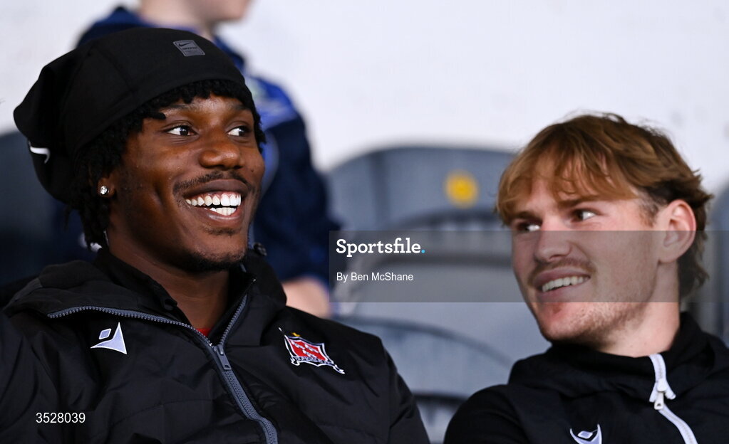 31 July 2026; Former Dundalk and current Burton Albion player Gbemi Arubiand and Norman Garbett, right, during the SSE Airtricity Premier Division match between Dundalk and Sligo Rovers at Oriel Park in Dundalk, Louth. Photo by Ben McShane/Sportsfile