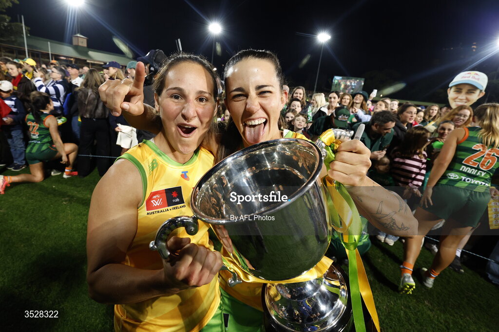 1 August 2026; Australia players Breanna Koenen and Chloe Molloy celebrate with the cup after victory in the AFLW test match between Australia and Ireland at the North Sydney Oval in Sydney, Australia. Photo by Darrian Traynor/Getty Images/AFL Photos via Sportsfile