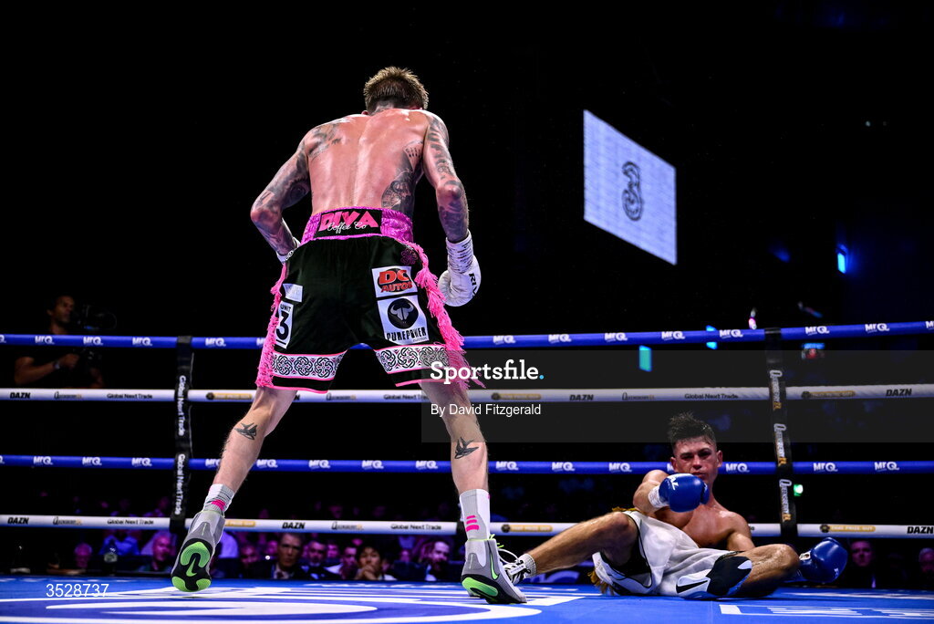 1 August 2026; Gary Cully, left, after knocking down Lee Reeves during their BUI Irish Super Lightweight Title bout during their BUI Irish Super Lightweight Title bout during the Boxing in Dublin event at the 3Arena in Dublin. Photo by David Fitzgerald/Sportsfile