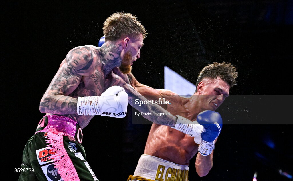 1 August 2026; Gary Cully, left, knocks down Lee Reeves during their BUI Irish Super Lightweight Title bout during their BUI Irish Super Lightweight Title bout during the Boxing in Dublin event at the 3Arena in Dublin. Photo by David Fitzgerald/Sportsfile