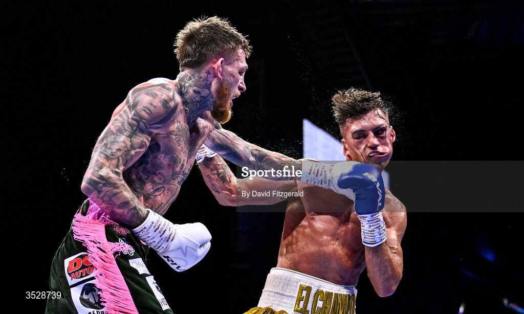 1 August 2026; Gary Cully, left, knocks down Lee Reeves during their BUI Irish Super Lightweight Title bout during their BUI Irish Super Lightweight Title bout during the Boxing in Dublin event at the 3Arena in Dublin. Photo by David Fitzgerald/Sportsfile