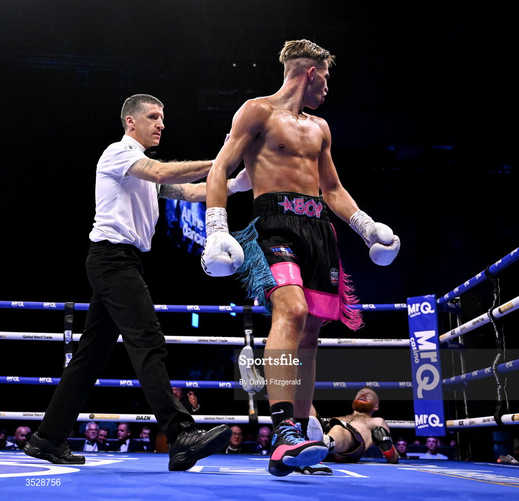 1 August 2026; John Joe Carrigan, left, after knocking down Sean Murray during their super welterweight bout during the Boxing in Dublin event at the 3Arena in Dublin. Photo by David Fitzgerald/Sportsfile
