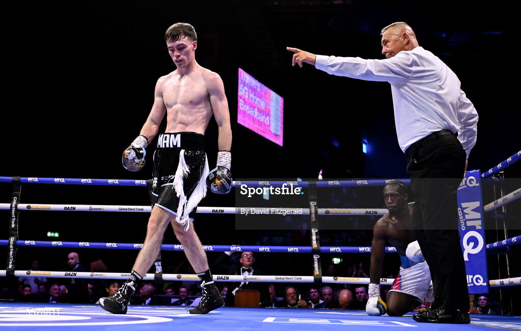 1 August 2026; Bobbi Flood, left, after knocking down Tariq Davis during their super welterweight bout during the Boxing in Dublin event at the 3Arena in Dublin. Photo by David Fitzgerald/Sportsfile