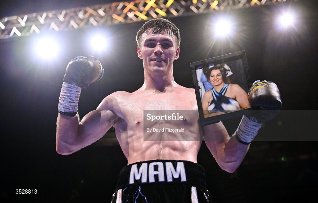 1 August 2026; Bobbi Flood holds up a photograph of his mother Cleevla after being declared victorious over Tariq Davis in their super welterweight bout during the Boxing in Dublin event at the 3Arena in Dublin. Photo by David Fitzgerald/Sportsfile