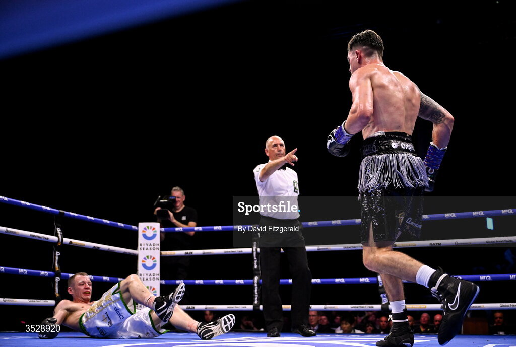 1 August 2026; Steven Cairns, rigtht, reacts after knocking down Senan Kelly in their super lightweight bout during the Boxing in Dublin event at the 3Arena in Dublin. Photo by David Fitzgerald/Sportsfile