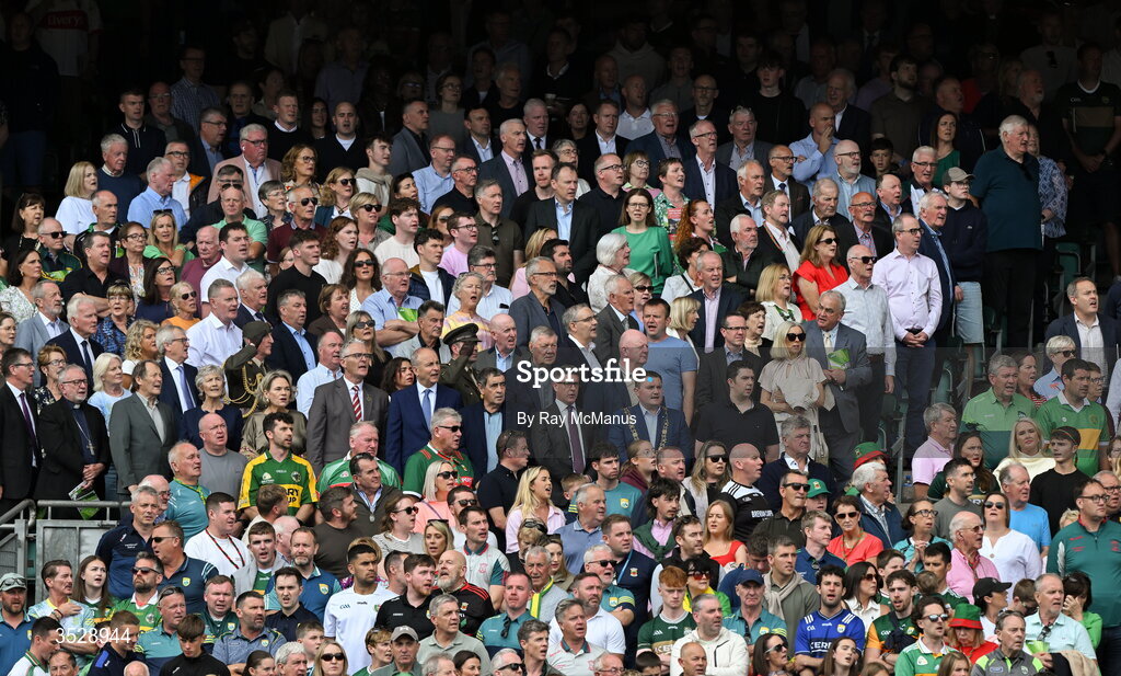 26 July 2026; Uachtarán na hÉireann Catherine Connolly, the Lord Mayor of Dublin Cllr Daryl Barron, Uachtarán Chumann Lúthchleas Gael Jarlath Burns, Ard Stiúrthóir of the GAA Tom Ryan, An Taoiseach Micheál Martin TD, former GAA presidents, and supporters of both teams stand facing the Tricolour for the playing of Amhrán na bhFiann before the GAA Football All-Ireland Senior Championship final match between Kerry and Mayo at Croke Park in Dublin. Photo by Ray McManus/Sportsfile