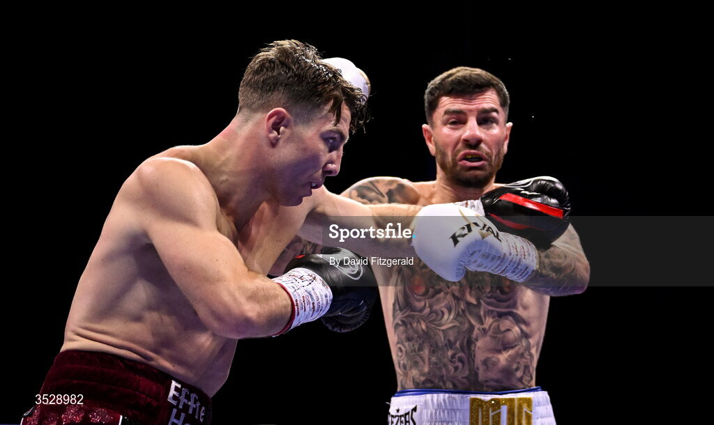 1 August 2026; Pierce O'Leary, left, in action against Mark Chamberlain during their IBO World Super Lightweight Title bout during the Boxing in Dublin event at the 3Arena in Dublin. Photo by David Fitzgerald/Sportsfile