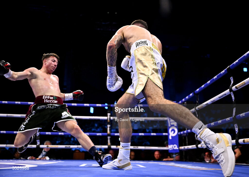 1 August 2026; Mark Chamberlain, right, knocks down Pierce O'Leary during their IBO World Super Lightweight Title bout during the Boxing in Dublin event at the 3Arena in Dublin. Photo by David Fitzgerald/Sportsfile