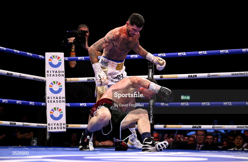 1 August 2026; Mark Chamberlain, top, knocks down Pierce O'Leary during their IBO World Super Lightweight Title bout during the Boxing in Dublin event at the 3Arena in Dublin. Photo by David Fitzgerald/Sportsfile