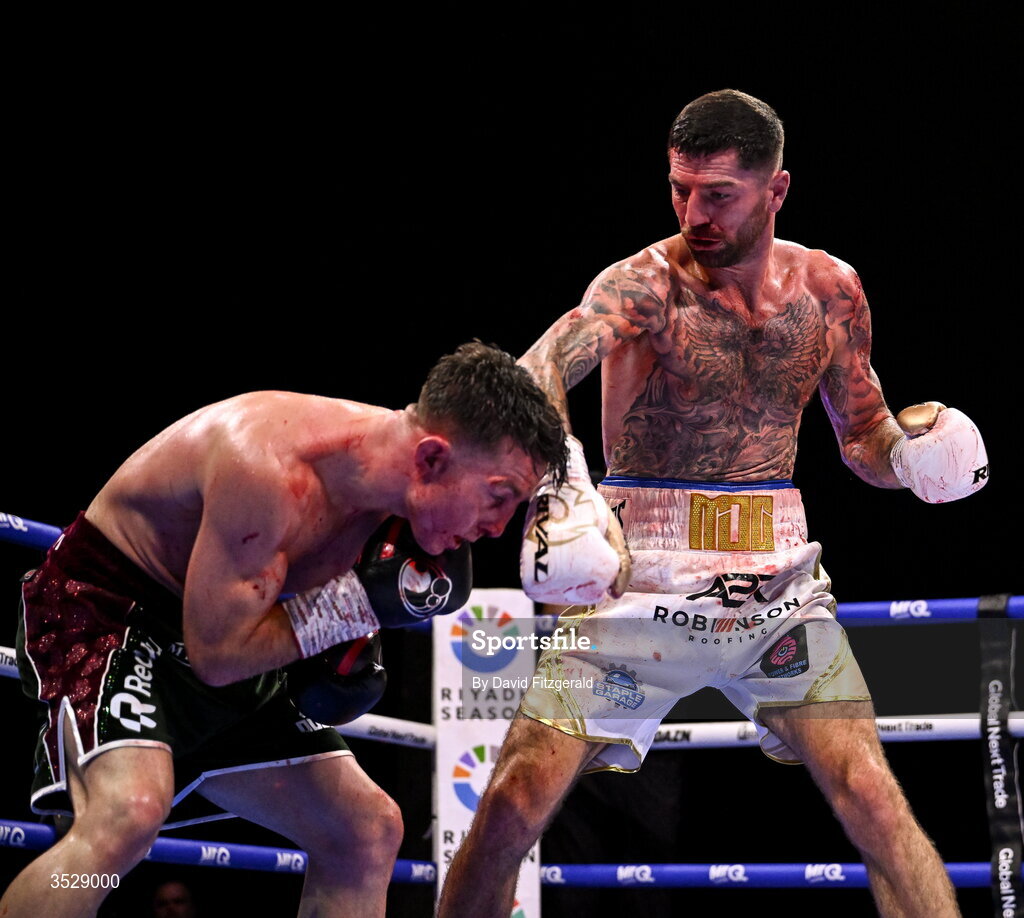 1 August 2026; Pierce O'Leary, left, in action against Mark Chamberlain during their IBO World Super Lightweight Title bout during the Boxing in Dublin event at the 3Arena in Dublin. Photo by David Fitzgerald/Sportsfile