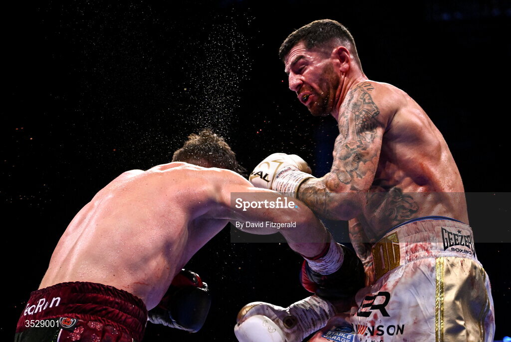 1 August 2026; Pierce O'Leary, left, in action against Mark Chamberlain during their IBO World Super Lightweight Title bout during the Boxing in Dublin event at the 3Arena in Dublin. Photo by David Fitzgerald/Sportsfile