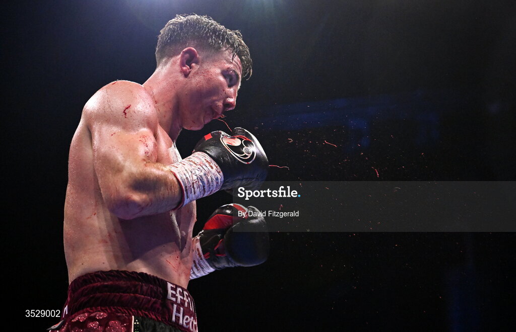 1 August 2026; (EDITORS NOTE: Image contains graphic content) Pierce O'Leary spits out blood during his IBO World Super Lightweight Title bout against Mark Chamberlain during the Boxing in Dublin event at the 3Arena in Dublin. Photo by David Fitzgerald/Sportsfile