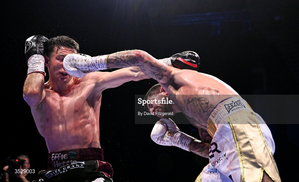 1 August 2026; Pierce O'Leary, left, in action against Mark Chamberlain during their IBO World Super Lightweight Title bout during the Boxing in Dublin event at the 3Arena in Dublin. Photo by David Fitzgerald/Sportsfile